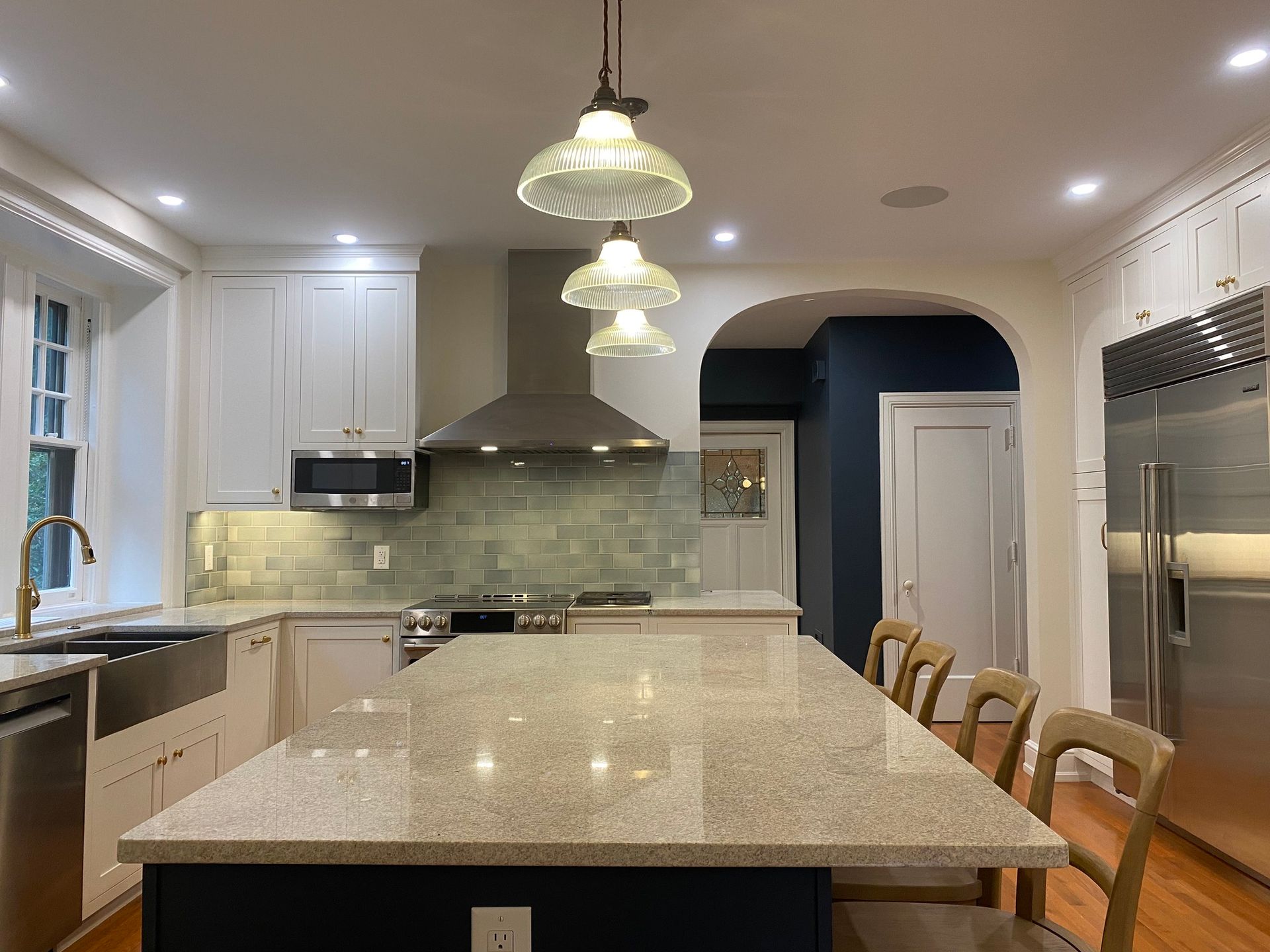 A kitchen with a large island and stainless steel appliances. James McCoy Remodeling Services Serving 19072,19003,19118,19444,19095 and surrounding areas
